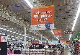 A well-placed sign above an aisle in a retail store.
